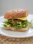 a close up of a delicious White Bean Veggie Burgers with Zucchini and Corn sandwich